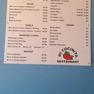 a menu on a blue wall