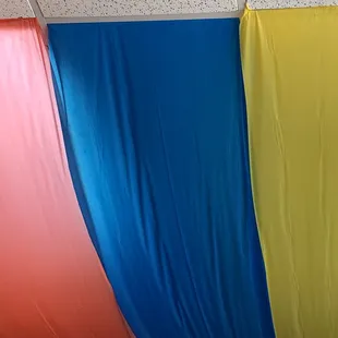 colorful curtains hanging from the ceiling