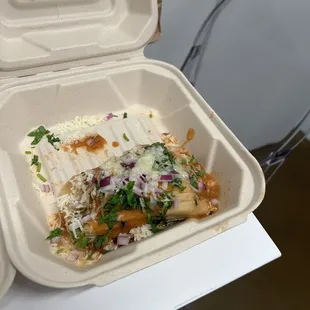 Tamale with a spicy red sauce very delicious