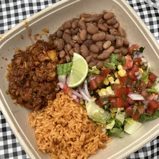 Yum! Super fresh and light (not greasy!). Pineapple chicken, beans, rice and a tomato/corn salad.