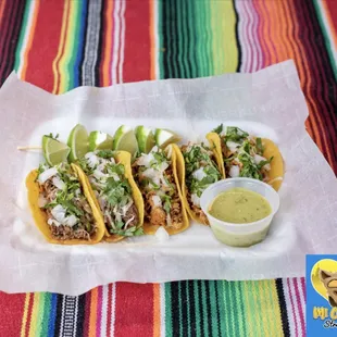 Taco Mix, beef asada and chicken fajita street tacos, topped with onions, cheese &amp; cilantro. Limes and salsa verde on the side.