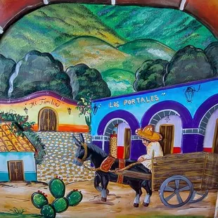 a mural of a mexican village