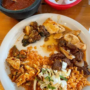 Starting from 11 o&apos;clock: papas con chorizo, chicken, steak fajitas, and rice w/ cheese and scrambled eggs.