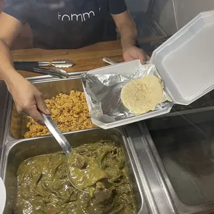 Bistek con nopales (steak and cactus) and frijoles con jamón (eggs with bacon in background). Breakfast offerings.
