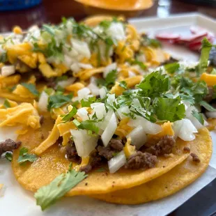 Street tacos with yellow cheese