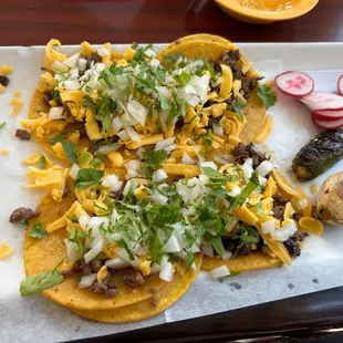 Street tacos with yellow cheese