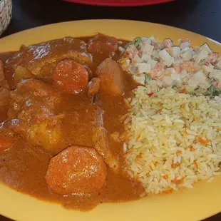 More chicken in a tomato sauce with rice, sweet potato, potato salad