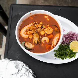 a bowl of shrimp and vegetable soup