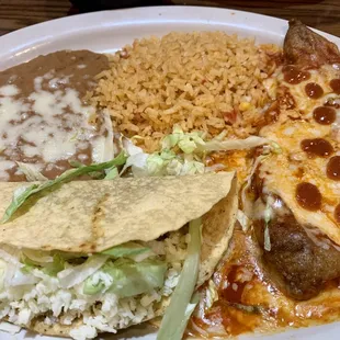 Chile relleno, rice, beans and a taco.