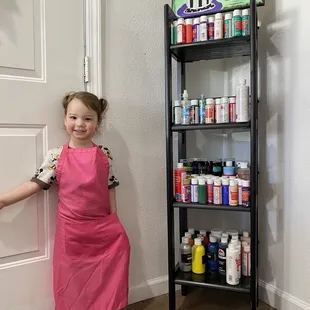 In her Happi Place, next to all the paints!