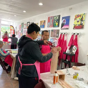 Father/ son working hard on their bottle opener project.