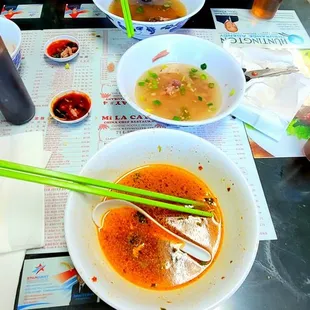 a woman eating a bowl of soup