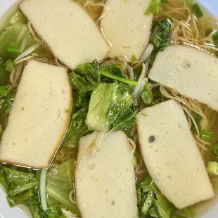 Large Fish Cake over Al Dente Egg Noodles with bean sprouts &amp; lettuce.