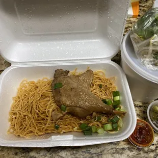 a meal in a styrofoam container