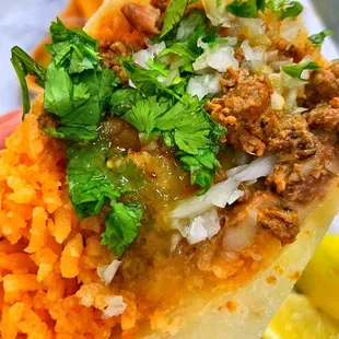 a hand holding a sandwich