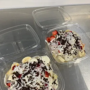 two trays of fruit salad