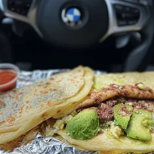 L: Baleada Regular w/ beans, cheese, sour cream ($3.50), R: Baleada Super w/ beans, cheese, sour cream, eggs, avocado ($5)
