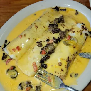 Jalisco beef enchiladas with cheese sauce. Subbed the ground beef for diced fajita meat.