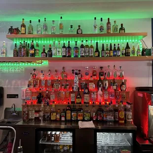 a shelf of liquor bottles