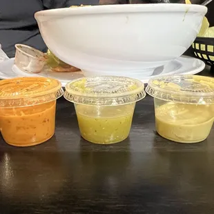 L-R Orange salsa was the hottest/best, green one was really good, guacamole-salsa was good but this batch had too much salt for me.