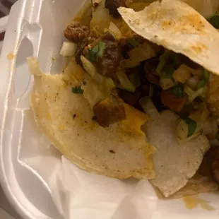 a taco in a styrofoam container