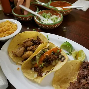 Carnitas tacos and cabeza tacos.