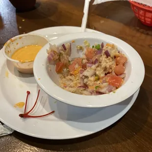 Ceviche with spicy sauce and it came with a green sauce