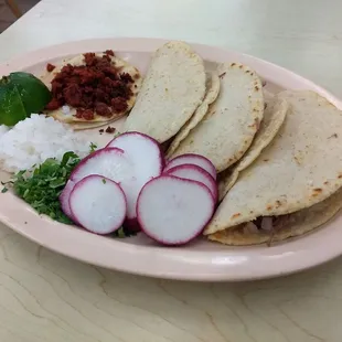 Birria tacos w/ hand made tortillas. Chorizo taco back there was killer. Clean and crispy, not greasy.