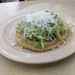 Sope sencillo. No meat, just creamy beans, fresh crunchy lettuce, savory Cotija cheese. Crema on the side like always.
