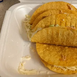 Hard shell chicken tacos and their complimentary salsa.