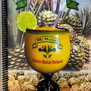 a drink in a glass with a lime slice