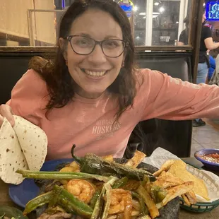 The foggy glasses are from the steam rolling off this sizzling clay pot dish!