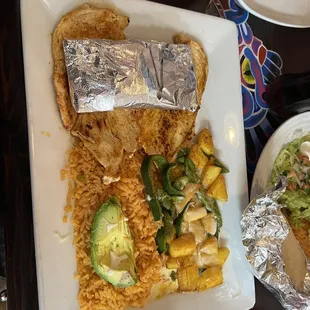 a plate of mexican food on a table