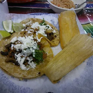 Yummy!! Tacos and tamales!!!! Delicious and cheap!