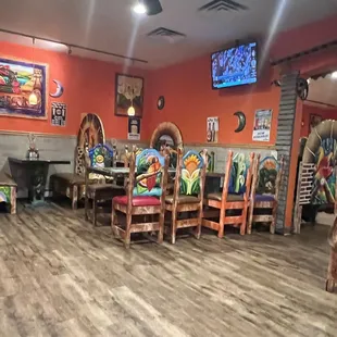 a mexican restaurant with wooden tables and chairs