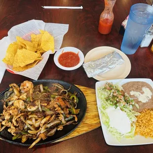Shrimp beef chicken and chorizo fajitas