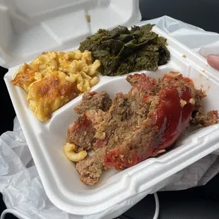 Meatloaf, greens, and macaroni and cheese.