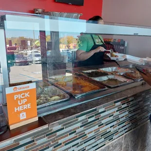 Buffet style where you pick what you want and the plate it for you.