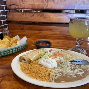 A delicious Peach Margarita on the rocks and their Chimichanga Plate