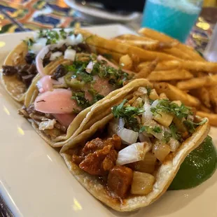 Mixed taco plate: steak, carnitas, Al pastor with fries