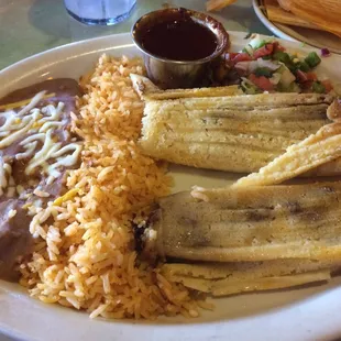 Perfect tamales - thin layer of masa, thick layer of shredded beef and chili on the side.