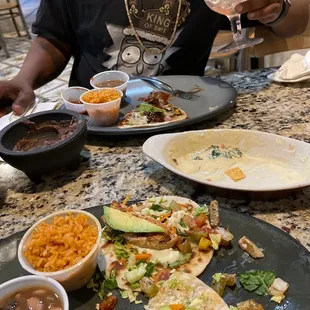 Baja Fish taco and what&apos;s left of Brisket Taco...with medium margarita actually we had two and they were pretty strong.