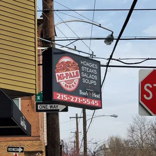 a stop sign in front of a restaurant