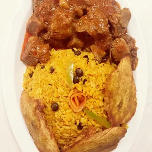 Carne guisada , arroz con gandules y tostones Beef stew, yellow rice with peas and green plantains