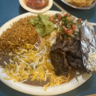 Enchilada and carne asada plate