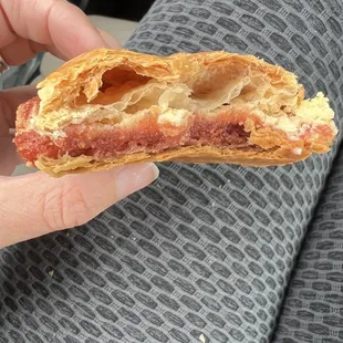 a person holding a pastry