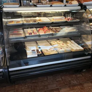 a display case filled with pastries