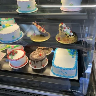 a display of cakes