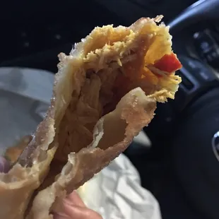 Inside chicken empanada. It's wide and looks flat but lots of chicken