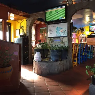 The entrance with the main dining room behind the TV.